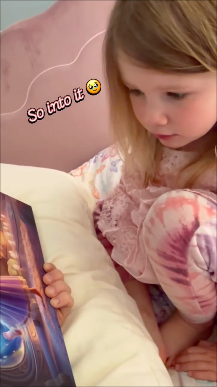 A child reading a personalized birthday storybook gift by YaGee